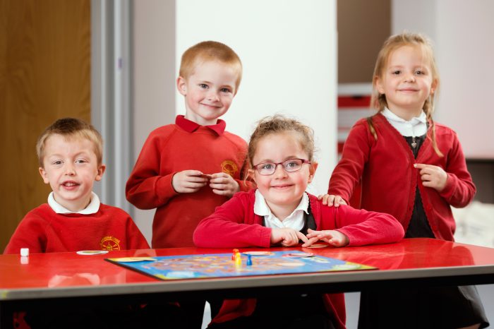 Pupils from St. Geraldine Primary playing a board game