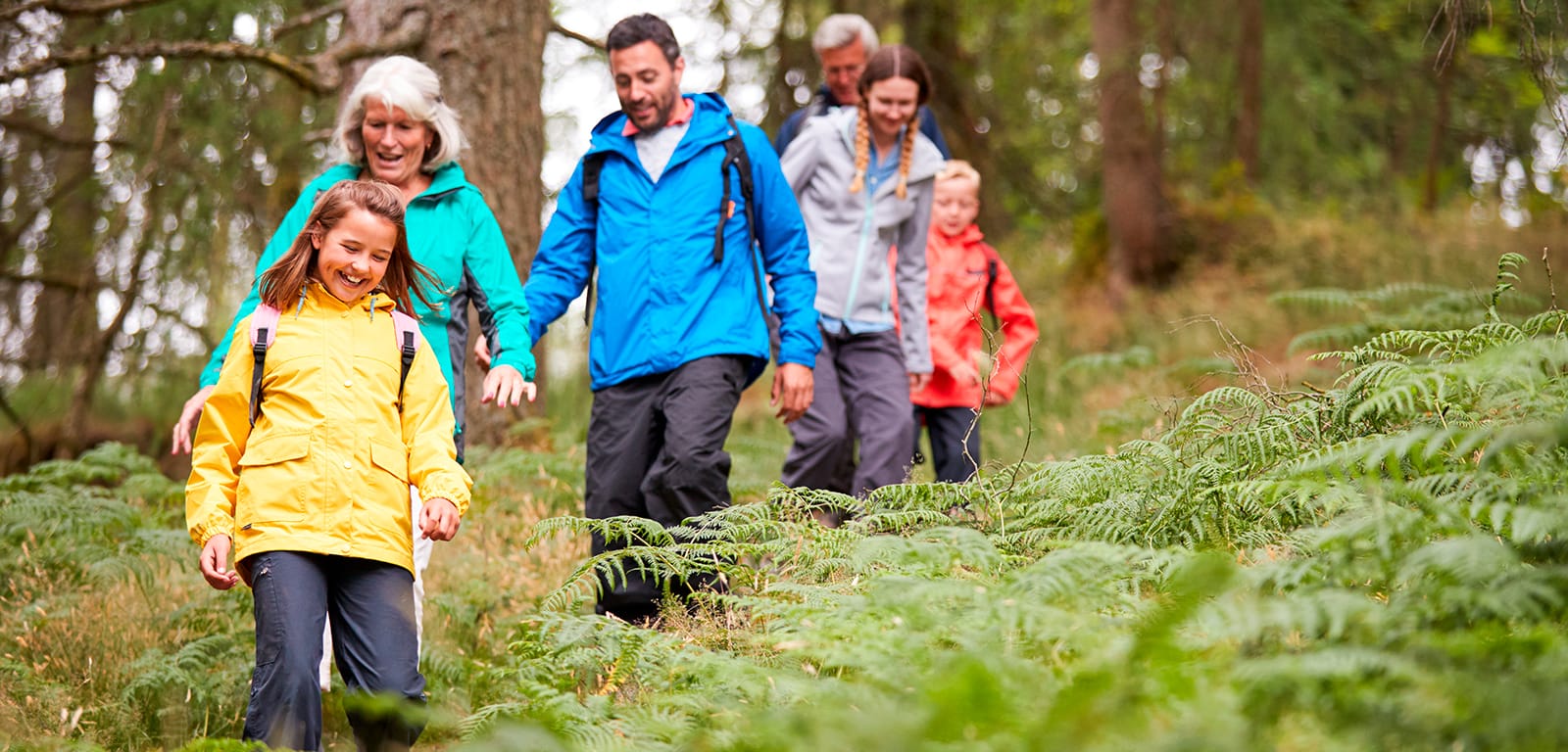 A happy family hiking in the woods