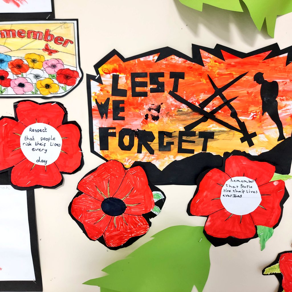 Raigmore primary remembrance wall close up on a sillouette of a lest we forget sign