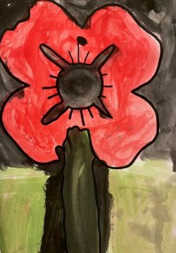 Close up of a child's watercolour poppy on a black background