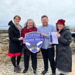The FCE website team at Edinburgh Castle to pick up their finalist certificate