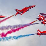 The Red Arrows aerobatic team with their signature coloured exhaust smoke