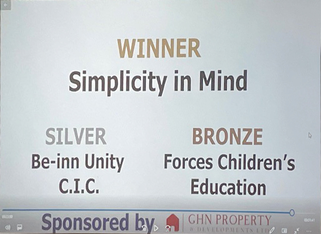 A still from the screen at the ceremony showing the Winner, Simplicity in Mind, Silver award for Be-Inn Unity CIC, and Bronze award for Forces Children's Education