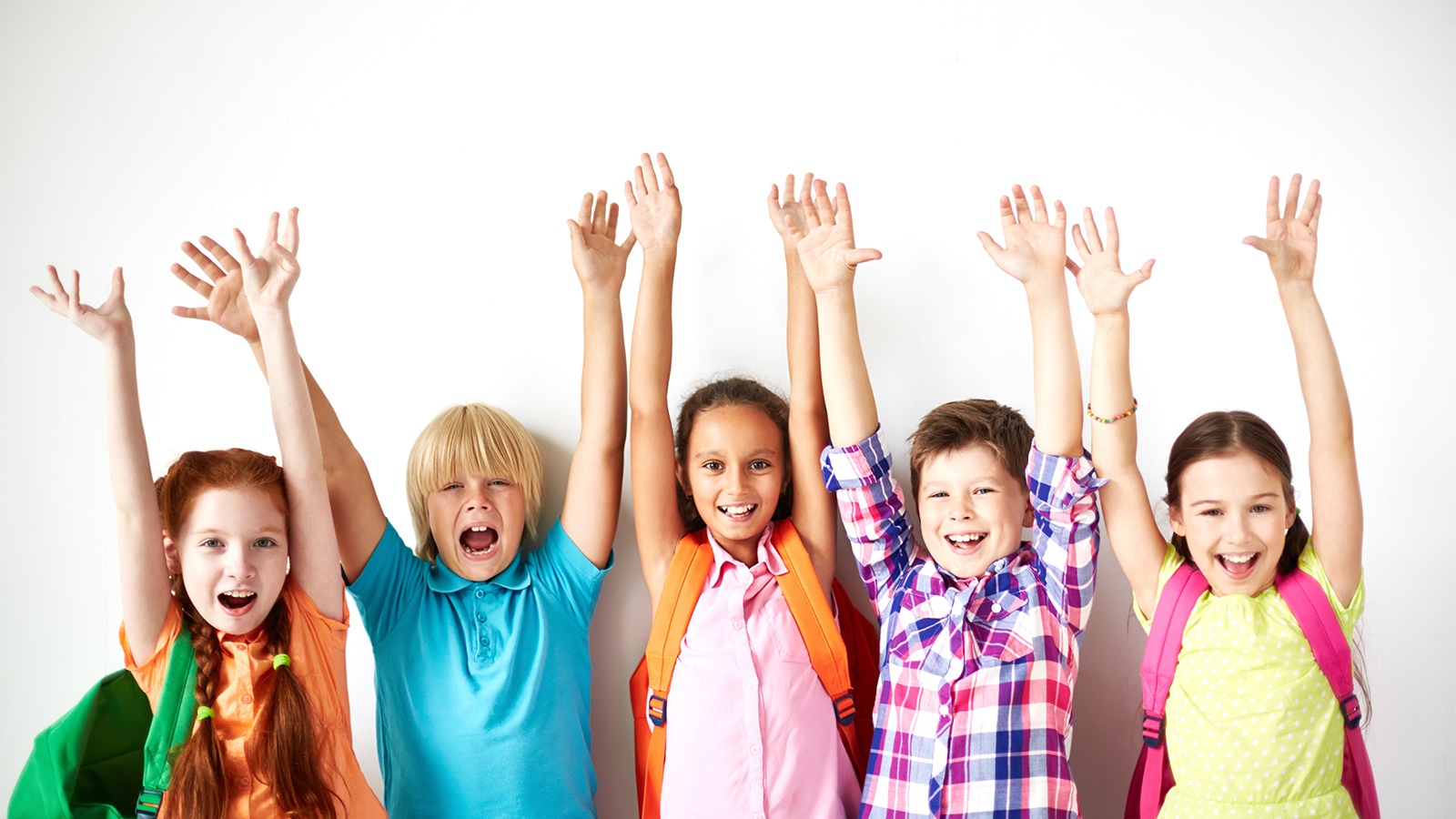 Three girls and two boys raising their hands in excitement