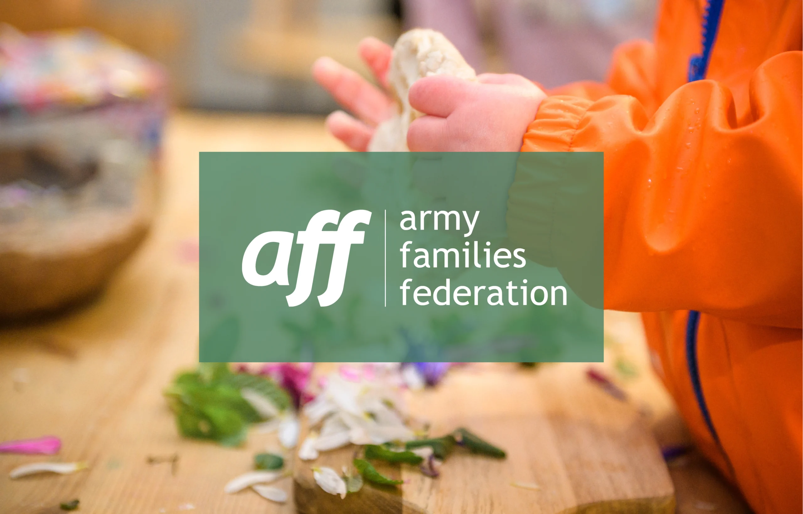 Army Families Federation logo over the top of an image of a small child baking