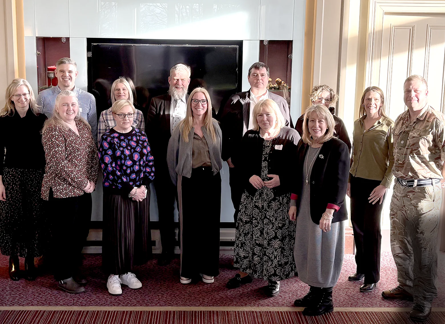 A group of workshop attendees gathered in the sunshine for a picture.