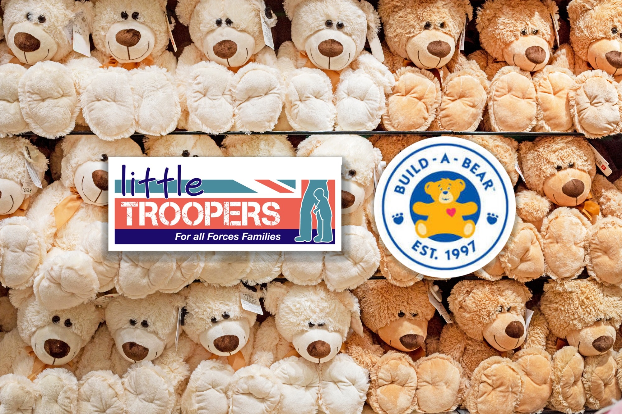 A wall of teddy bears in a shop with the little troopers and build a bear logos